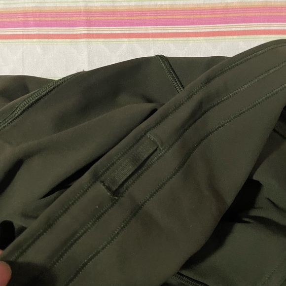 Lululemon high waisted legging in olive. Luxtreme material. Size 4. Mesh sides. - Picture 3 of 5